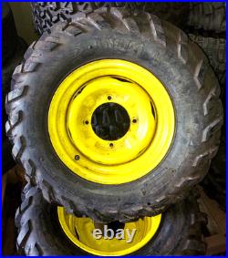 John Deere Gator 12 Yellow Steel Wheel 4 Lug withANCLA M/T 25x8-12 Tire